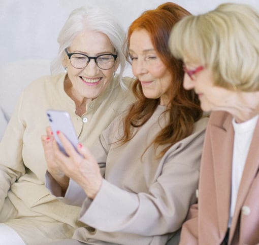 three elderly women videochatting